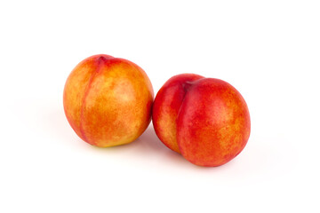 Fresh peaches, isolated on white background.
