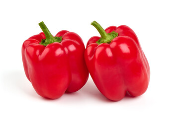 Red ripe bell peppers, isolated on white background.