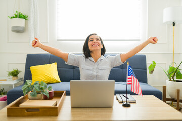 Happy woman excited about studying English online in the US