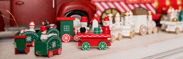 Wooden toy train. Christmas trip. Christmas card. toy vintage steam locomotive.New year celebration concept.toy store. web banner
