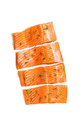Salmon fillet steaks, raw fish with thyme and herbs. Transparent background. Isolated.