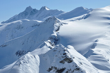 Snow covered mountain slopes in the Alps