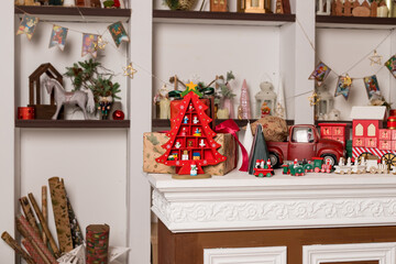 Wooden toy houses and christmas toy decoration on store showcase decorating for New Year and Christmas.Festive mood. toy shop