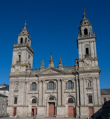 Fototapeta na wymiar The historic cathedral of Lugo, Spain with twin towers against a clear blue sky.