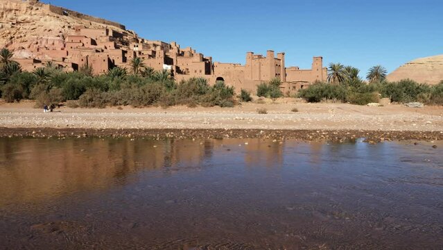 The Ksar Kasbah Ait Benhaddou in Morocco. A rural village with old clay houses, authentic traditional South Moroccan country-style adobe architecture. 4k footage. 