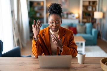 Young female freelancer or remote teacher using laptop, remote studying, virtual training,...