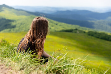 Head of a young woman against the background of mountains, Biszczady, Poland