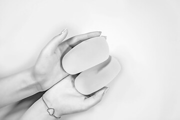Orthopedic insoles for shoes on a colour background. Foot care