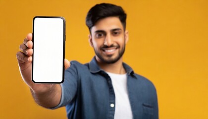 Close up of man hand holding modern smart phone mockup, yellow background, text space