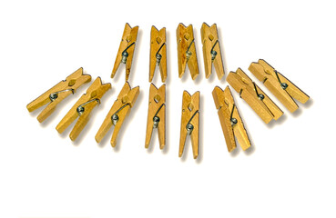 Wooden clothespin on white background with shadow reflection below.