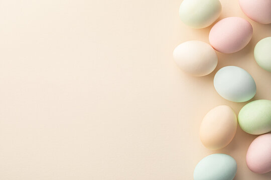 Easter eggs on a light creamy background with a blank copy space for Easter