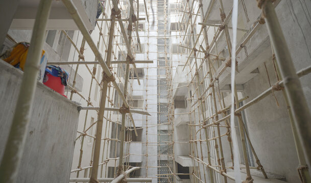apartment construction, Bamboo scaffolding in construction site stock photo, Under Construction