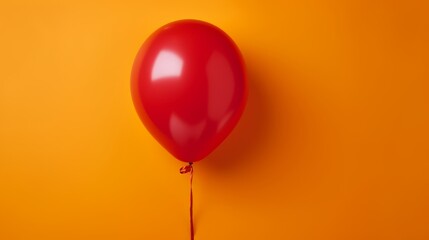 Red Rubber Balloon on yellow background. Party, Birthday, Celebration. 