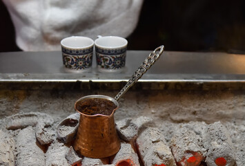 Ember Turkish coffee. Roasted Turkish coffee. Traditional nubian coffee making. Coffee turk on the...