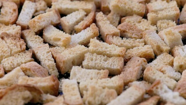 white bread croutons on flat surface, full-frame closeup view.