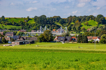 Caestert plateau with green esplanade, suspension bridge, Kanne village and hill with green leaf...