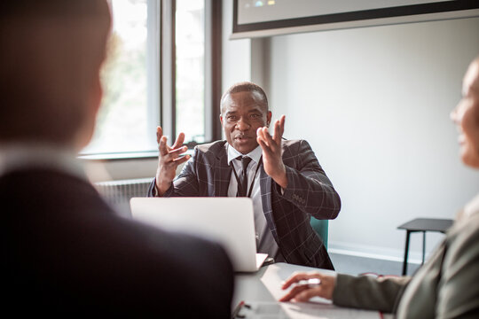 Businessman talking expressing himself during meeting