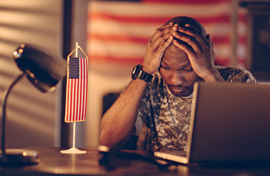 American soldier being tired and missing home while being deployed in an army base