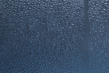 Water drops on the window after rain, wet glass texture