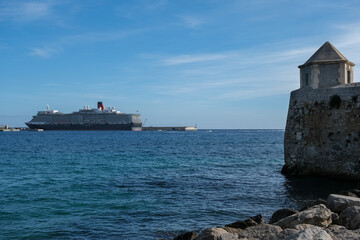 Classic british luxury ocean liner cruiseship cruise ship in Ibiza port with red, black and white...