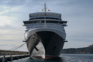 Classic british luxury ocean liner cruiseship cruise ship in Ibiza port with red, black and white...