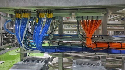 A bundle of colorful cable in production room of factory