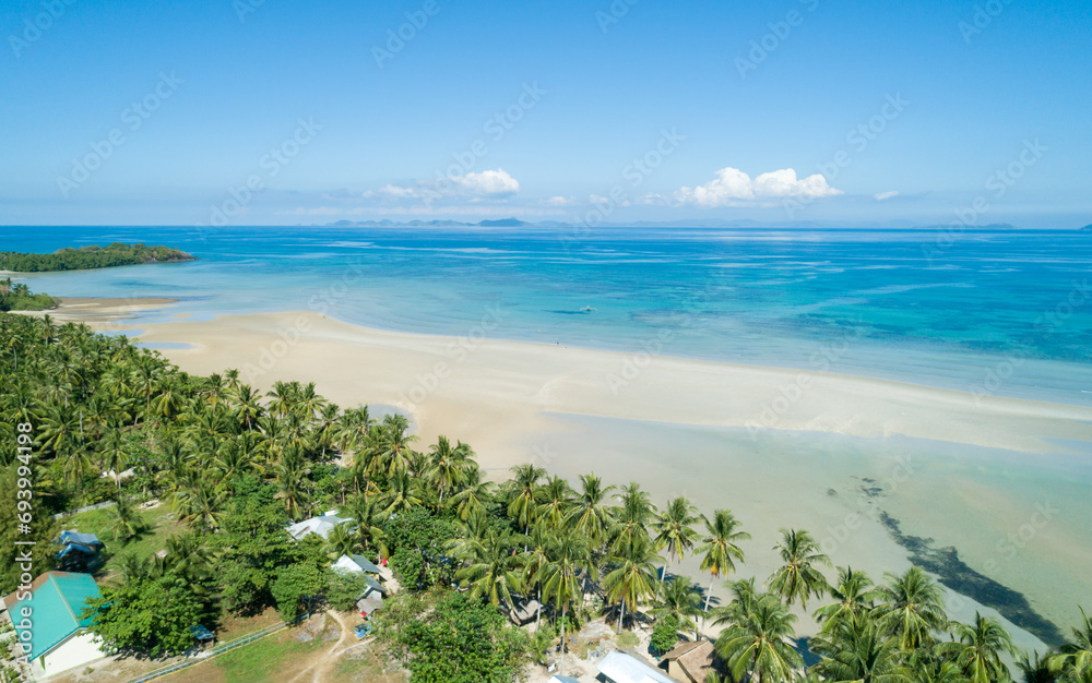 Wall mural Aerial view of tropical sandy beach in bay with blue water. Seascape with sea, sand, palm trees. Summer and travel vacation concept. - Wall murals