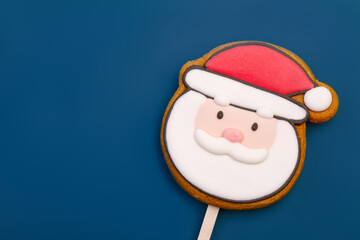 Santa Claus Gingerbread Cookie Pop on blue background