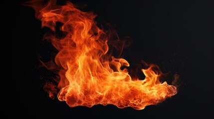 Close-up view of a vibrant fire burning on a black background. Suitable for various uses