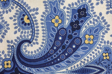 Paisley floral pattern fabric closeup in blue