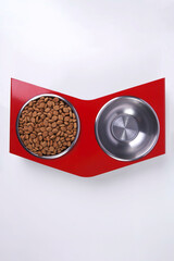 Dry dog and cat food in metal bowl, top view and flat lay