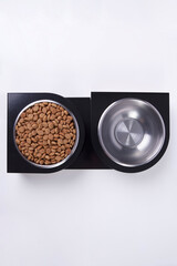 Dry dog and cat food in metal bowl, top view and flat lay