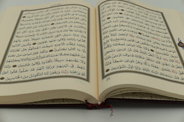Photograph of the holy Quran taken on a white background, in Konya, Turkey, on December 16, 2023