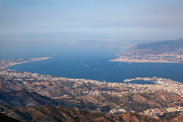 Panoramic view of the Strait of Messina, in the place planned for the construction of the longest single-span bridge in the world which will connect Sicily with the continent. - 694021900