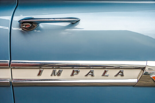 IMPALA lettering on a car door