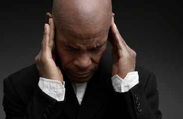 deafness suffering from hearing loss on grey black background with people stock image stock photo	