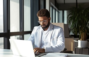 Busy professional business man, businessman worker financial manager using laptop working on pc computer technology typing searching online sitting at workplace desk in office.