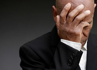 praying to god Caribbean man praying with black background with people stock photo