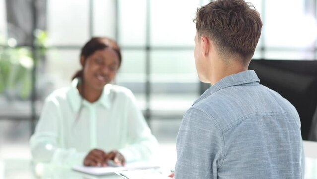 Group of business persons talking in the office.