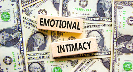Emotional intimacy symbol. Concept words Emotional intimacy on beautiful wooden blocks. Dollar...