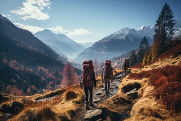 A group of adventurers stand in awe of the breathtaking mountain landscape, surrounded by towering peaks and a vast expanse of sky, as they embark on an invigorating hike through the rugged terrain o - obrazy, fototapety, plakaty