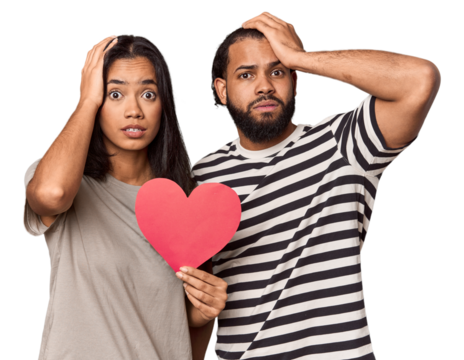 Latina couple with Valentine's sign being shocked, she has remembered important meeting.