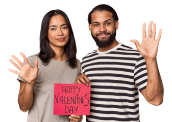 Latina couple with Valentine's sign smiling cheerful showing number five with fingers.