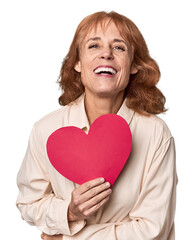 Middle-aged Caucasian woman with Valentine's heart expressing emotions