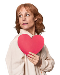 Middle-aged Caucasian woman with Valentine's heart expressing emotions