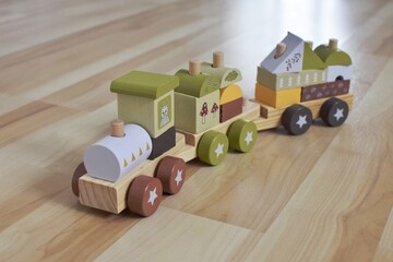 A toy wooden train consisting of different blocks. A children's toy for the development of a child.