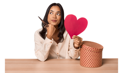 Young latin woman crafting a personal gift to her couple
