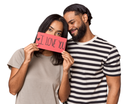 Young Latin couple holding 'I love you' sign, Valentine's