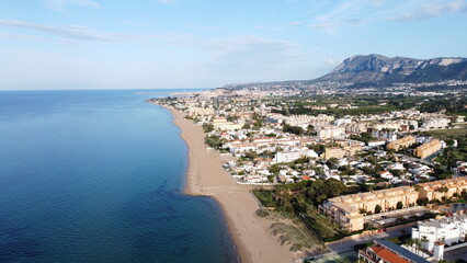 vista aerea de Denia, catalunia, españa, desde la playa con un drone mostrando el mar mediterraneo...