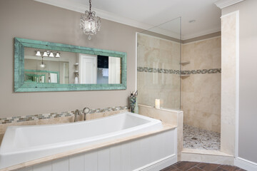 Bathroom with soaking bath tub and walk in shower at Florida vacation rental property